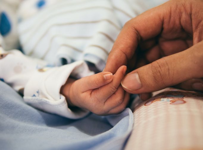 Baby and mother hands